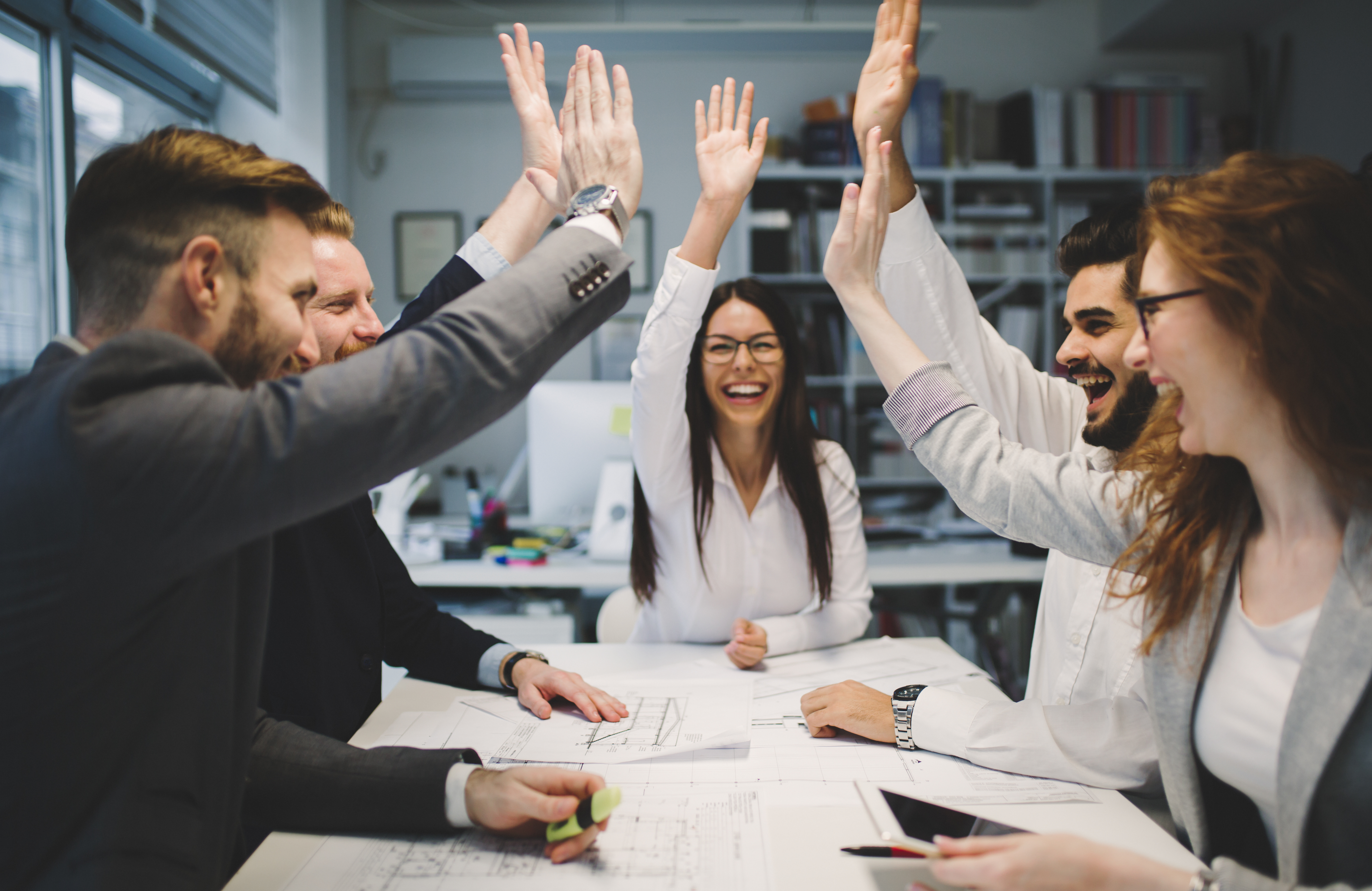 A meeting of people high fiving